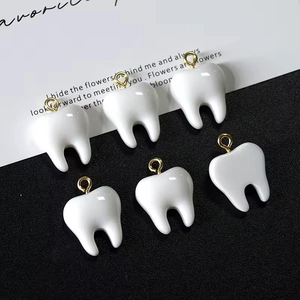 Set of six creative resin tooth charms with gold metal rings for DIY jewelry making