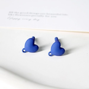 Close-up of matte royal blue heart earrings with hanging loop for DIY jewelry making