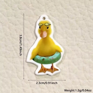 Detailed acrylic yellow duck charm size measurements with green swim ring and goggles