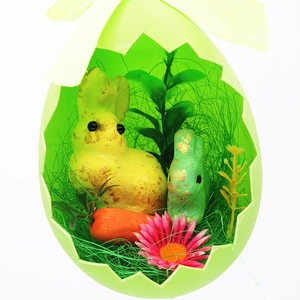 Easter foam egg shell box with cartoon rabbits and carrot decorations for spring holiday