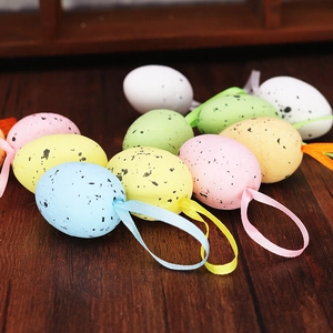 Detailed view of colorful speckled foam Easter eggs with hanging ribbons for decoration