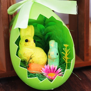 Detailed Easter egg container featuring cute resin bunnies, carrot and floral decor