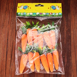 Detailed view of 12 foam Easter carrots in a Happy Easter gift bag on wooden surface
