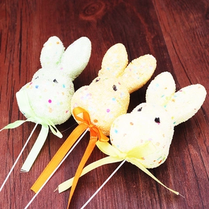 Three colorful foam Easter bunny stakes with pearl texture and ribbons for garden decor