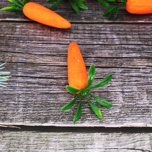 Realistic 7cm foam Easter carrots with green leaves on a rustic wooden background