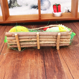 Detail of a rustic Easter nest featuring foam eggs, sunflowers and wooden fence elements