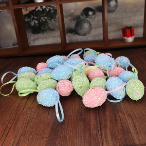 Detail of speckled foam Easter eggs with colorful beads and satin ribbons on wood