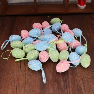 Detailed macro view of colorful spotted Easter foam eggs with hanging ribbons on wood