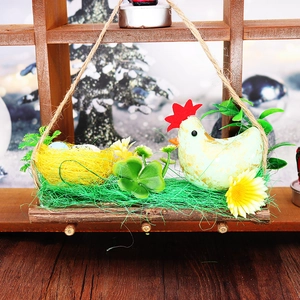 Easter foam chicken nest hanging decoration with eggs, green hen and clover on wood
