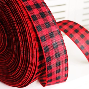 Macro view of red and black buffalo plaid ribbon texture for Christmas decor