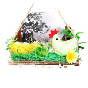 Easter farmhouse decoration featuring a wooden house, hen on a nest, eggs, and floral accents