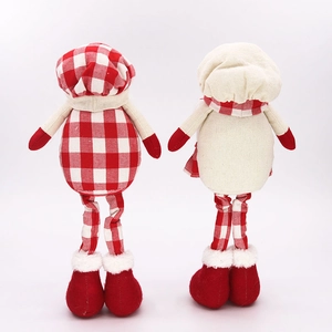 Christmas faceless gnome figurines set in red plaid fabric with long iron legs