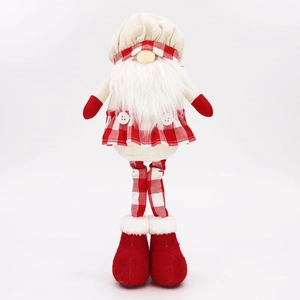 Close-up of Christmas gnome figure featuring white knitted hat and red plaid clothing