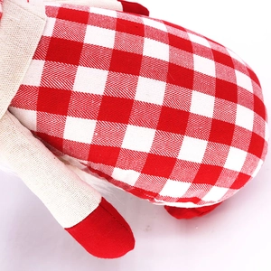 Christmas faceless gnome doll with red and white checkered fabric and smooth red edging