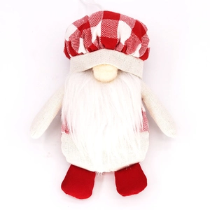 Detail of a Christmas gnome ornament featuring a red checkered hat and soft plush beard