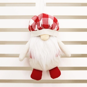 Close-up of a chef gnome ornament with red plaid hat and long white beard for Christmas