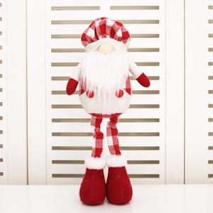 Detail of a Christmas gnome figurine with long legs, red buffalo check hat and white beard