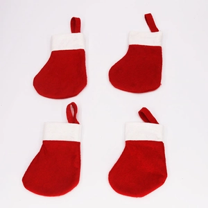 Set of four mini red and white Christmas stocking cutlery holders with hanging loops