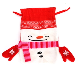 Detail of red Christmas snowman gift bag with embroidery and festive drawstring