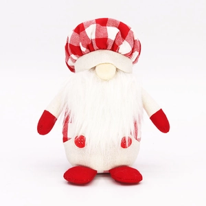 Detail of a Christmas gnome doll with a red and white checkered hat and white plush beard
