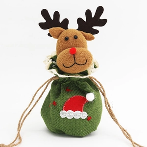Detail of green burlap Christmas gift bag with a plush reindeer head and drawstring
