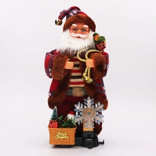 Detail of Santa Claus ornament with plaid coat and Merry Christmas basket decoration
