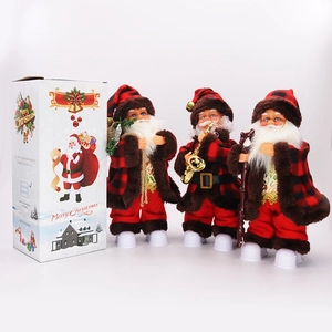 Detail of Christmas Santa doll in red plaid outfit with saxophone and festive packaging