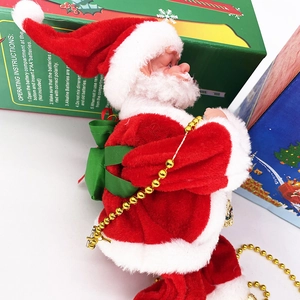Detail of red electric Santa Claus toy with gold bead chain and battery compartment view