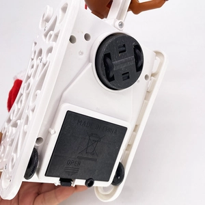 Detail of electric Santa sleigh bottom featuring battery compartment and wheels