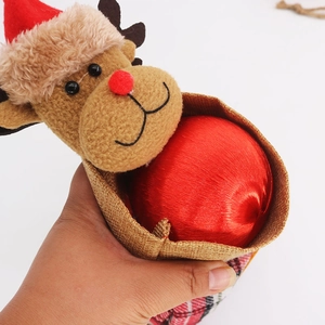 Detail of reindeer Christmas gift bag with red plaid flannel and rustic burlap fabric