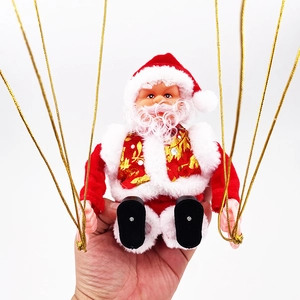 Detail of plush Santa Claus ornament with gold leaf vest and red velvet suit for Christmas