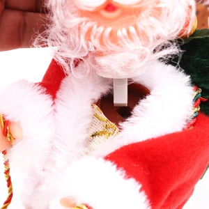Detailed close-up of the internal mechanical structure of the musical Santa toy