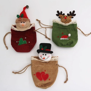 Detailed trio of burlap Christmas gift bags with lace trim and cartoon embroidery
