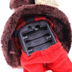 Detail view of the battery compartment for electric singing and dancing Santa Claus toy