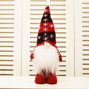 Handmade Christmas gnome plush with red knitted snowflake hat and white faux fur beard