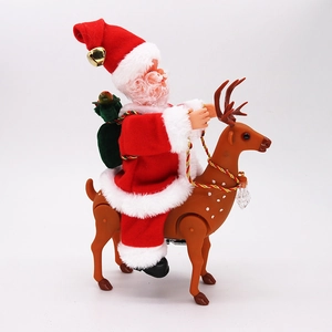 Close-up of electric Santa Claus toy on reindeer with green gift bag and gold bell
