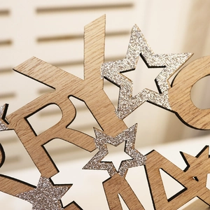 Wooden Merry Christmas tabletop sign with silver glitter stars and natural wood grain finish
