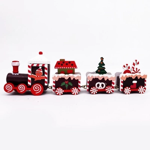 Christmas wooden toy train set with gingerbread man and festive gift cargo cars