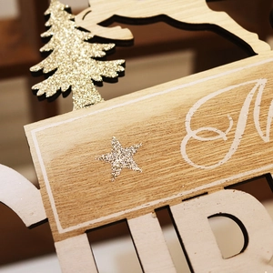 Wooden Merry Christmas door sign featuring glittery gold trees and reindeer laser-cut details