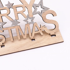 Detailed macro of wooden Merry Christmas table sign with sparkling silver star accent