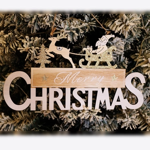 Wooden Merry Christmas door sign featuring Santa in a reindeer sleigh on a festive tree