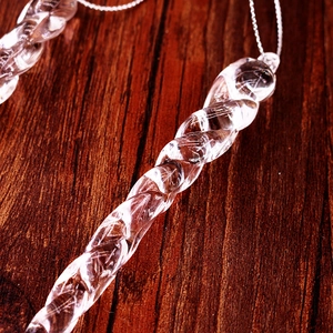 Macro shot of clear acrylic spiral icicle ornament with high refractive texture