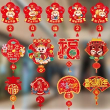 Collection of red and gold Chinese New Year paper decorations with rabbit and Caishen motifs