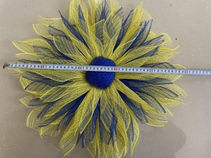 Close-up of yellow and blue mesh sunflower wreath showing large 55cm size measurement