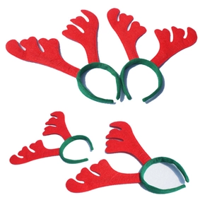 Detail of red and green Christmas reindeer antler headbands set for holiday party decor