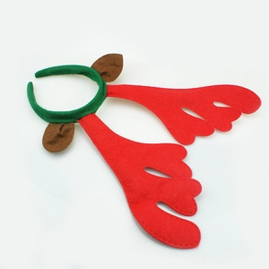 Detail of red Christmas reindeer antlers and brown ears on a green festive headband