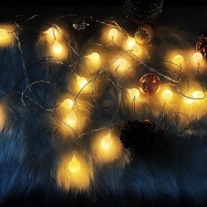 Warm white frosted LED globe string lights for festive Christmas and wedding home decor