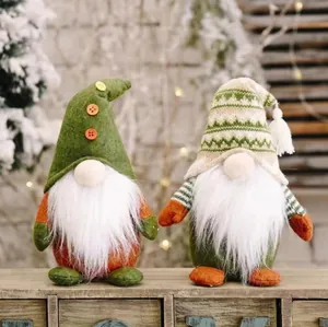 Handmade knitted Christmas Gnomes pair with white beard and pointed hats on wooden shelf