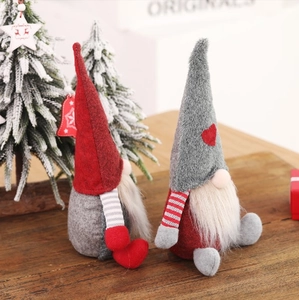 Pair of red and grey Christmas gnomes with long white beards and tall hats for holiday decor