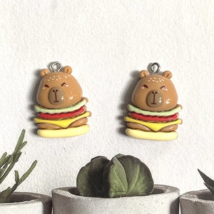 Detailed view of resin capybara burger charms for DIY jewelry and keychain accessories